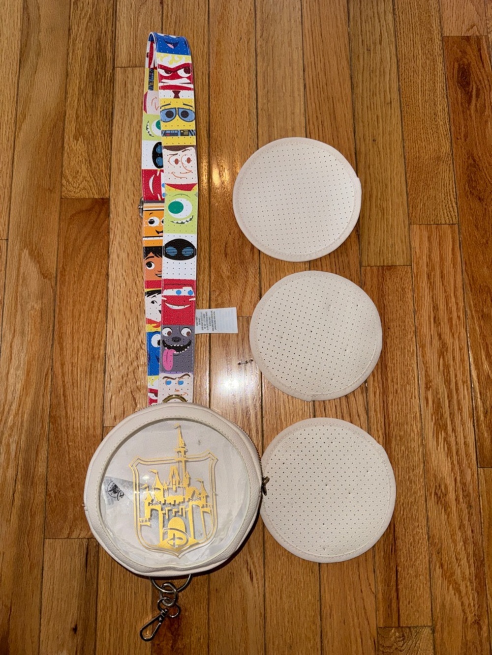 White Round Crossbody pin Bag with Gold Castle Emblem & Character Strap
